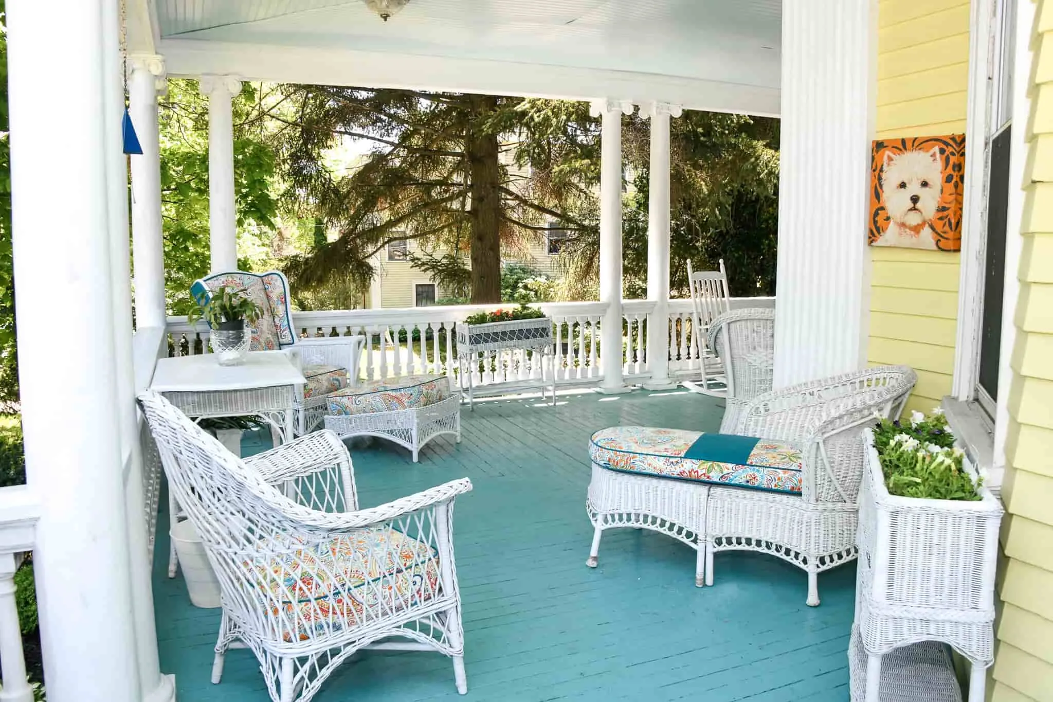 Wraparound porch with vintage wicker